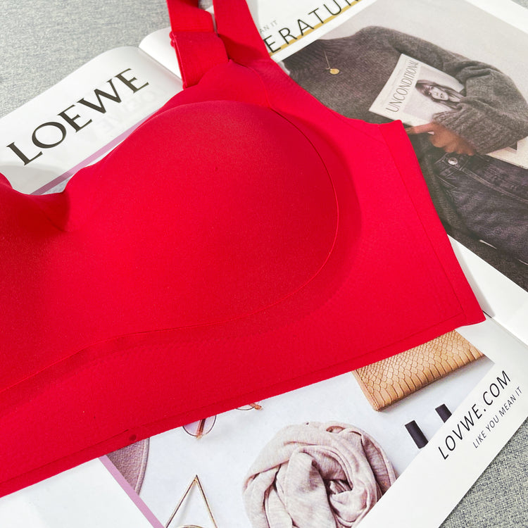 A close-up of a red wireless bra, focusing on the fabric and stitching details.