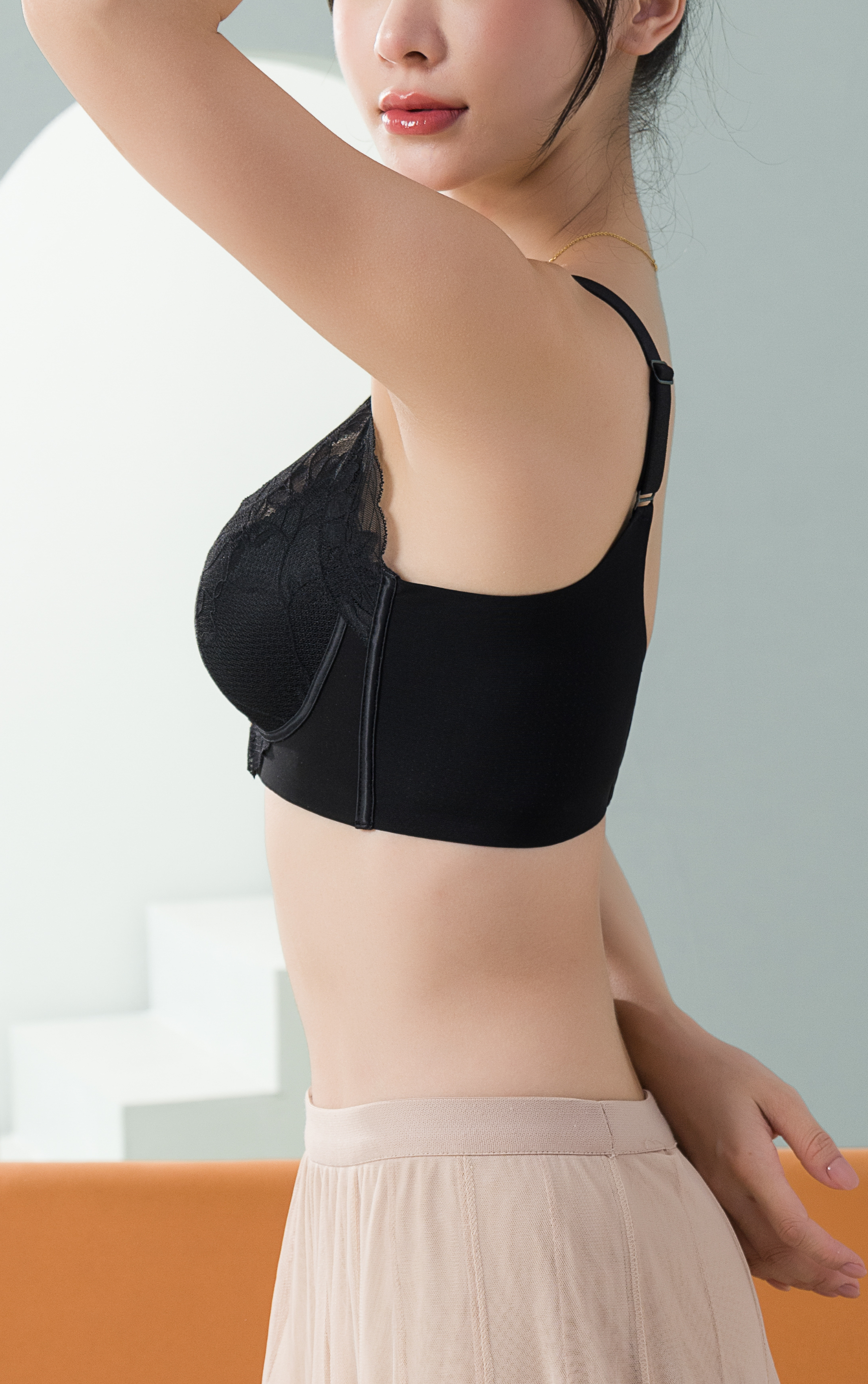 Angled view of green wireless 3D breathable push-up contour bra highlighting lace overlay