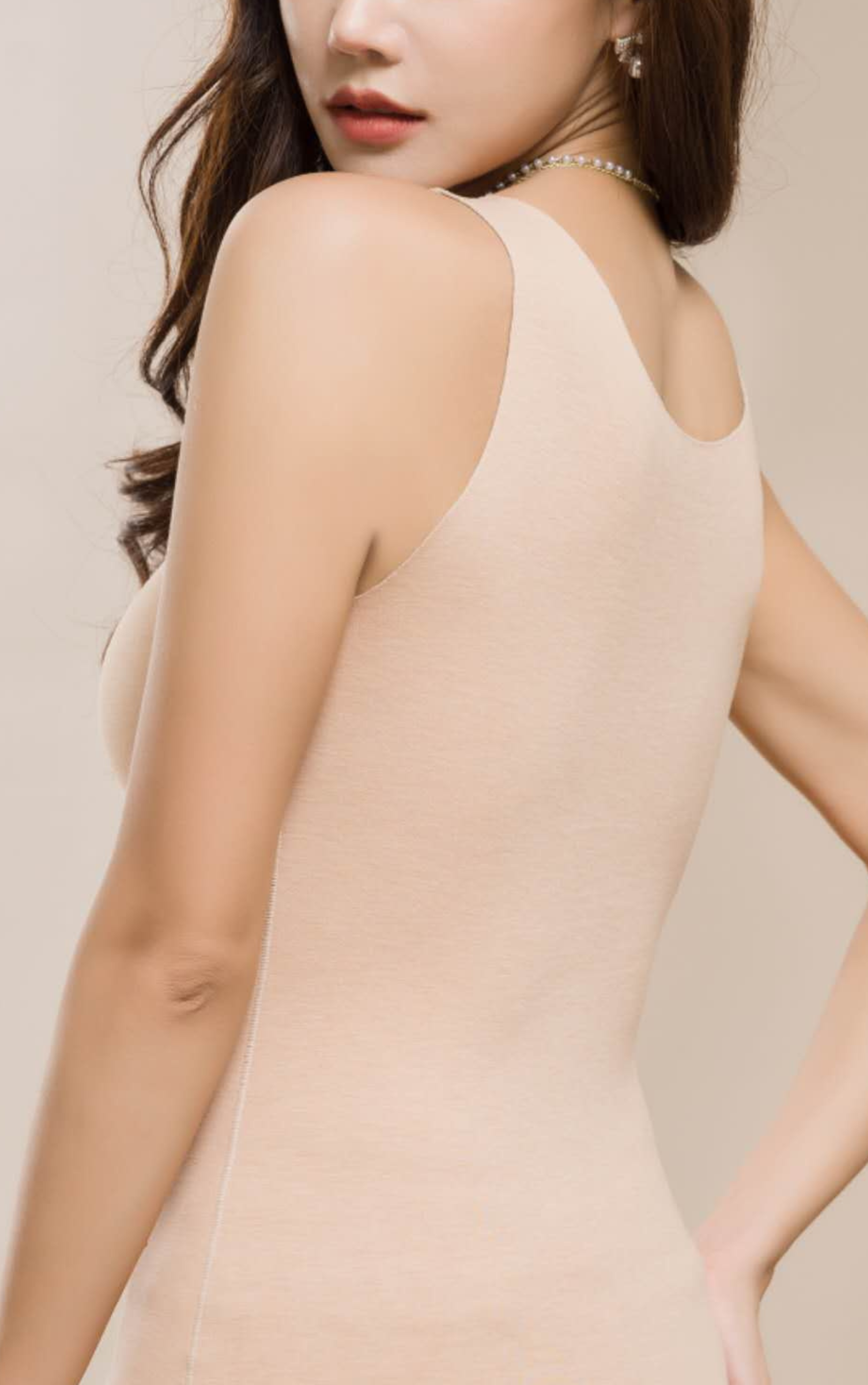 Detail view of beige silk thermal shapewear fabric showing lace trim
