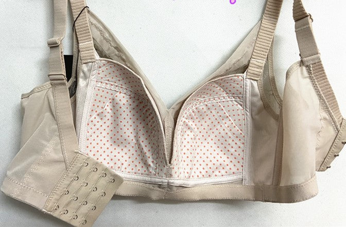 Interior view of beige wireless contour bra with breathable mesh lining and hook extension panel