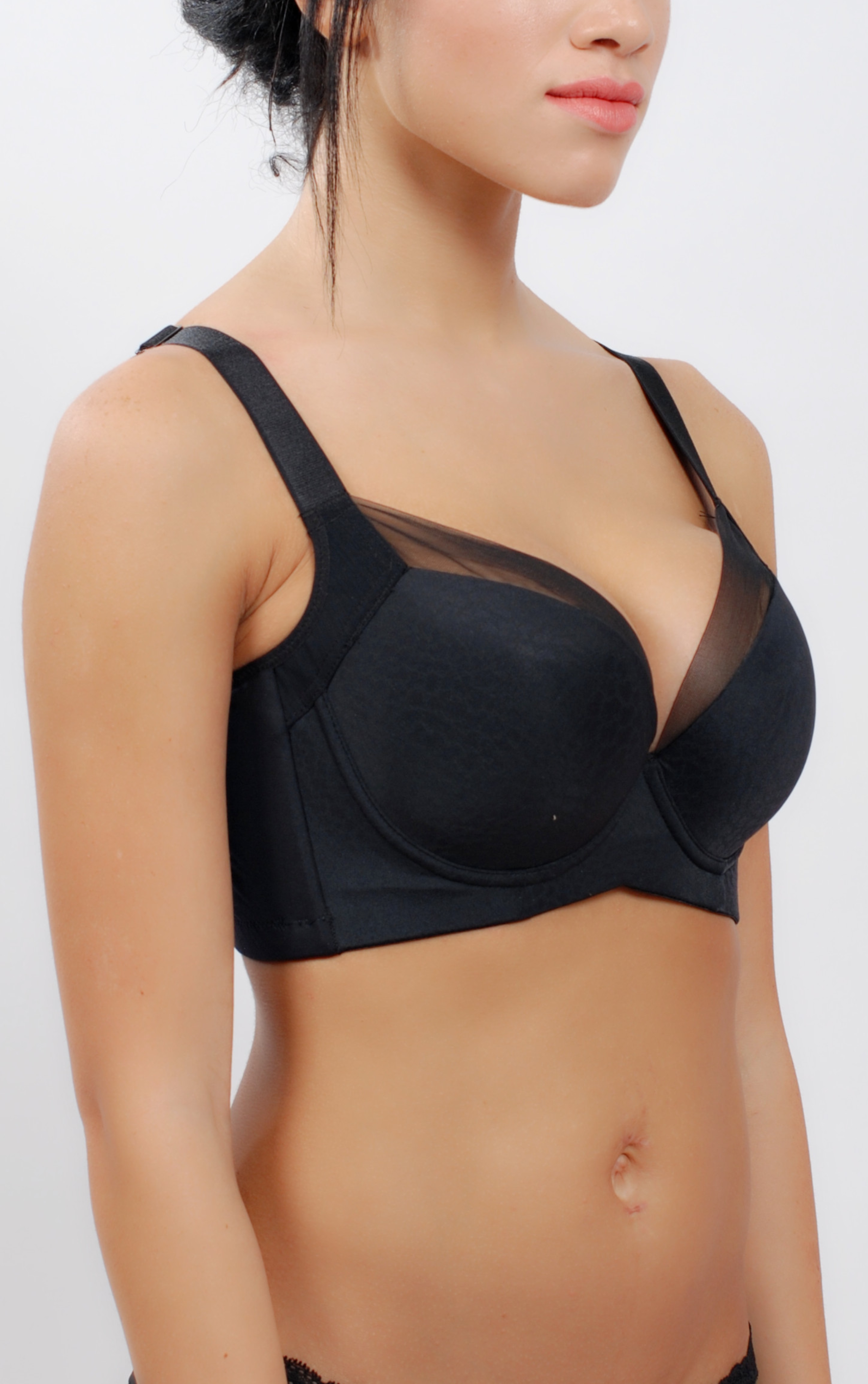 Side view of beige underwire contour bra showing wide back-smoothing sidebands