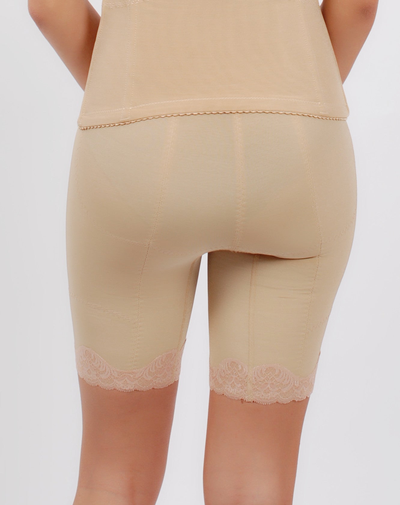 Front view of beige high-waist thigh slimmer shapewear shorts with seamless finish