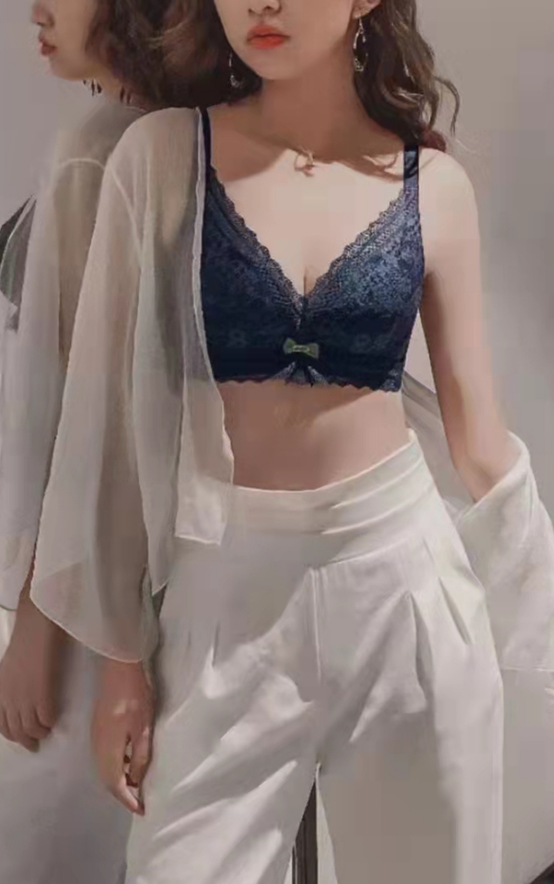 Side view of blue wireless lace contour bra showing wide back-smoothing sidebands