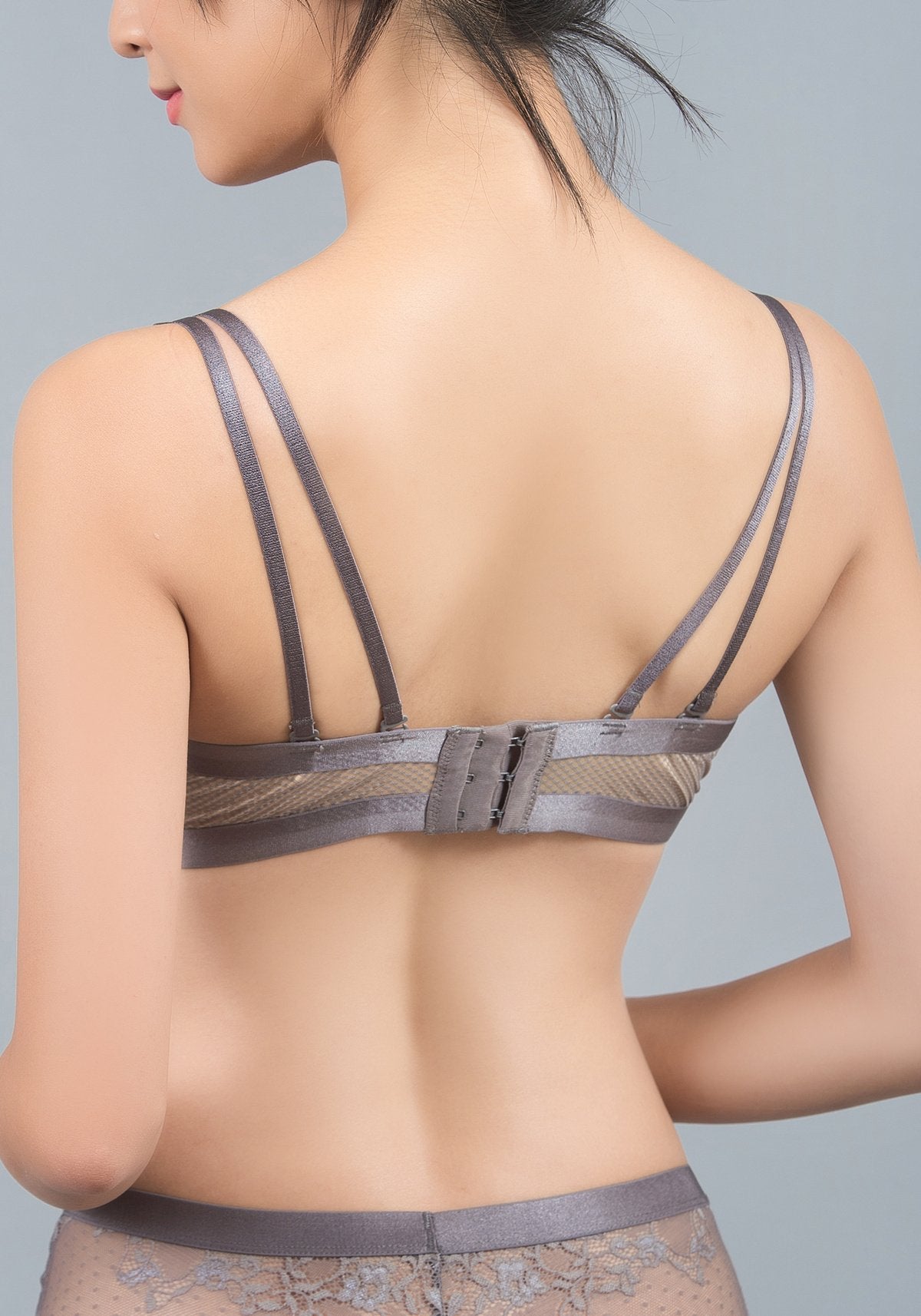 Angled view of black wireless demi silk contour bra with cross-back convertible strap option