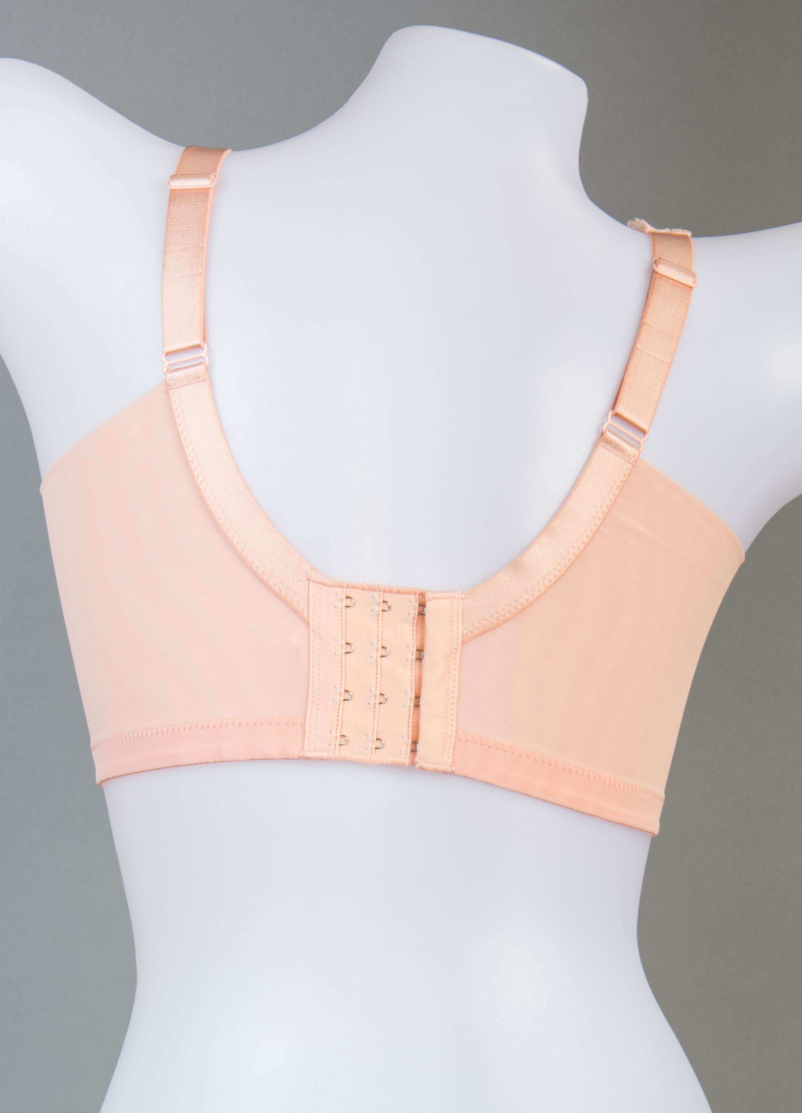 Back view of orange wireless full coverage contour bra highlighting adjustable straps
